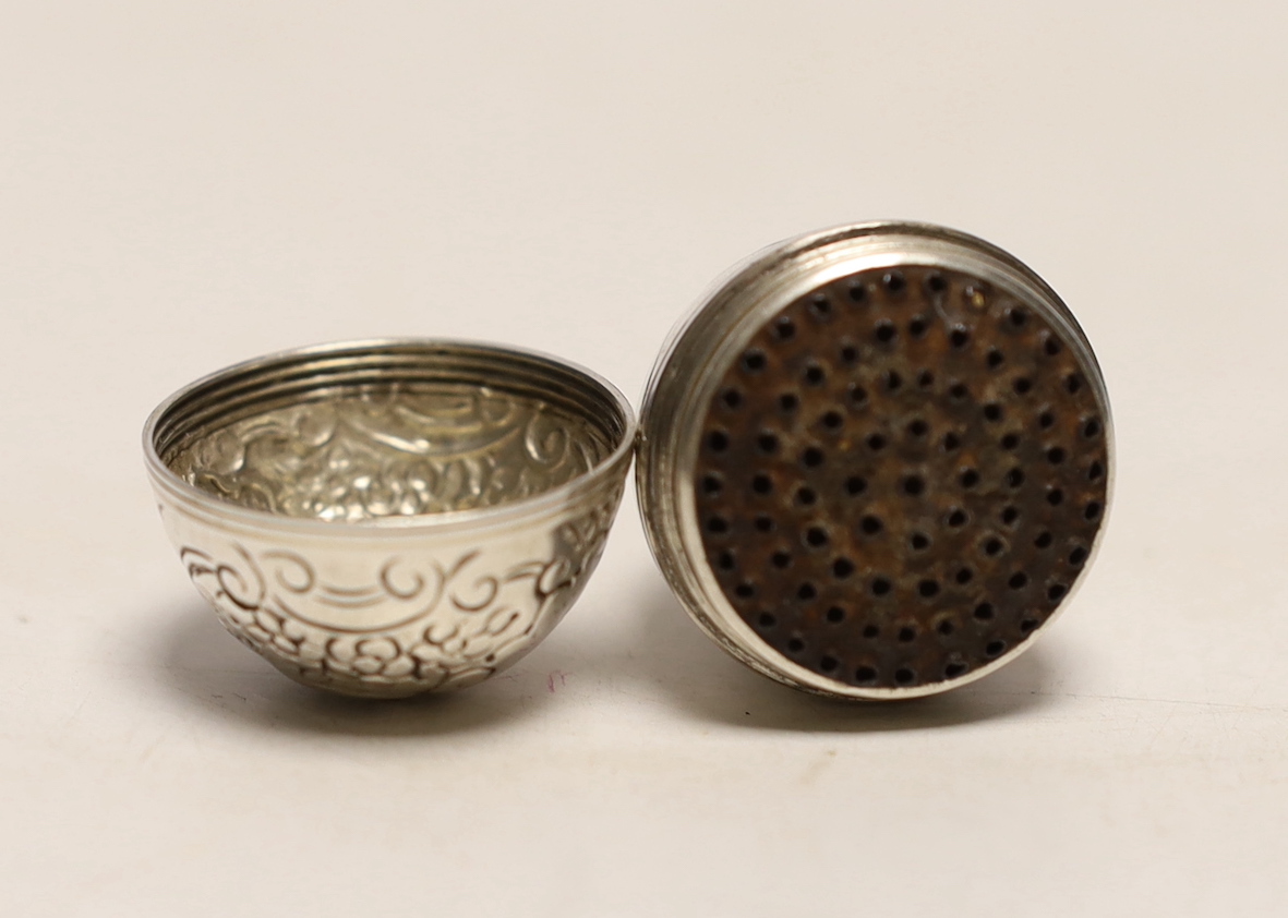 An engraved white metal egg shaped nutmeg grater, 40mm.